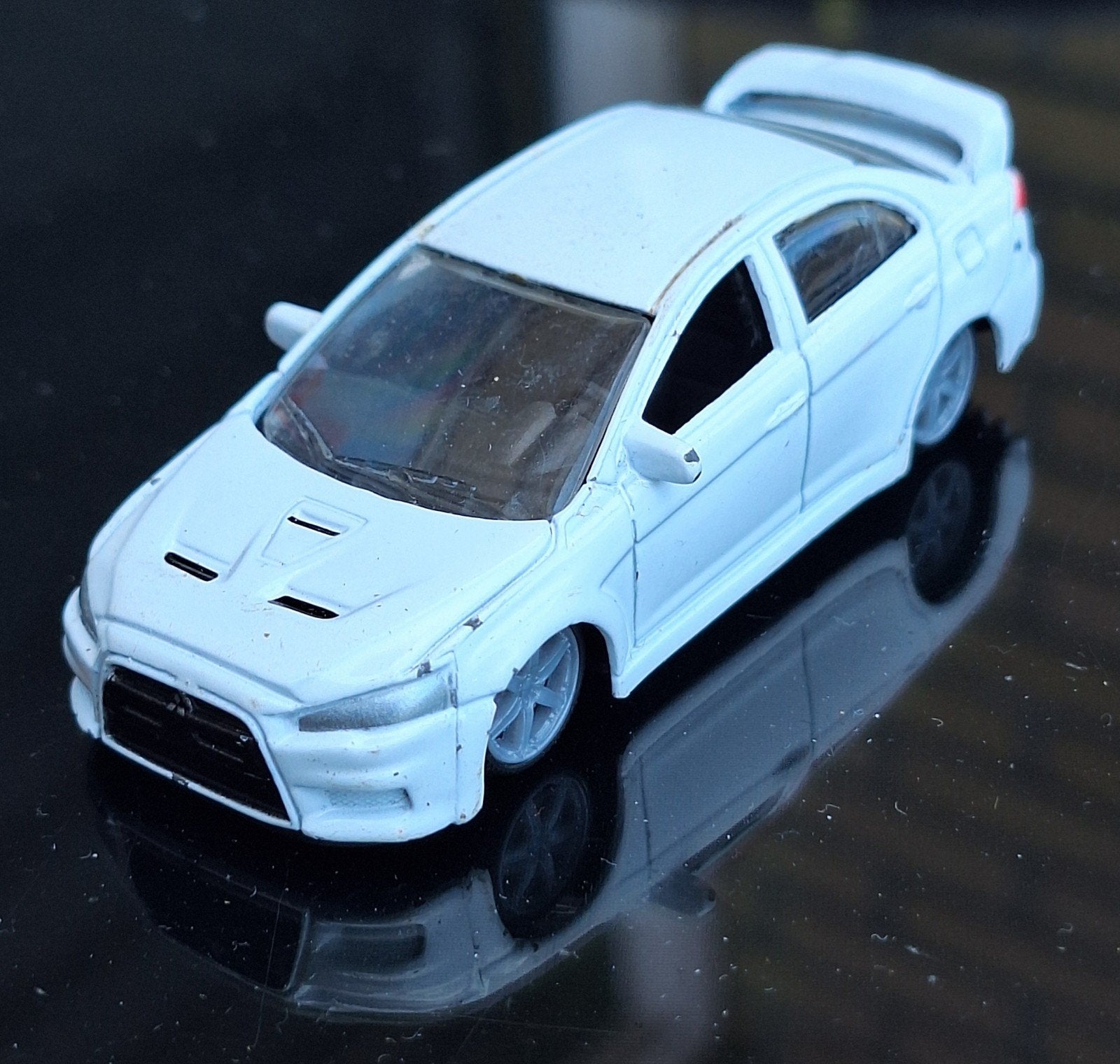 Burago Mitsubishi lancer evolution, Ophalen of Verzenden, Gebruikt, Auto