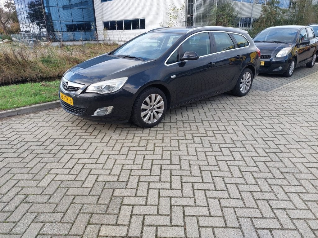 Nette Opel Astra 1.4 74KW Sports Tourer 2011 Zwart, Auto's, Voorwielaandrijving, 4 cilinders, Zwart, Origineel Nederlands