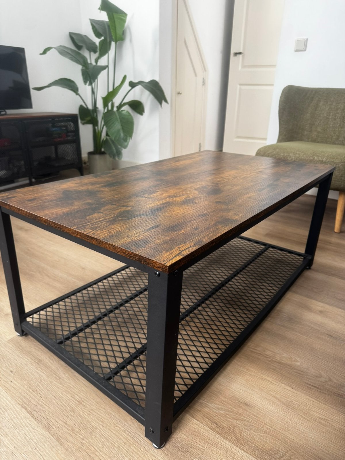 Industriële salontafel met houtlook en zwart metaal, Ophalen, Gebruikt, 100 tot 150 cm, 50 tot 100 cm