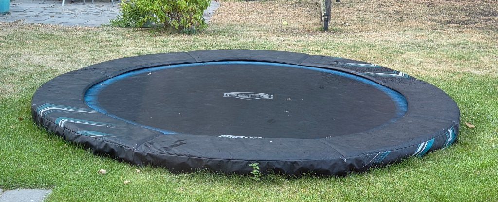 Trampoline Berg Champion inground black limited edit Ø 330, Kinderen en Baby's, Speelgoed | Buiten | Trampolines, Ophalen, Gebruikt