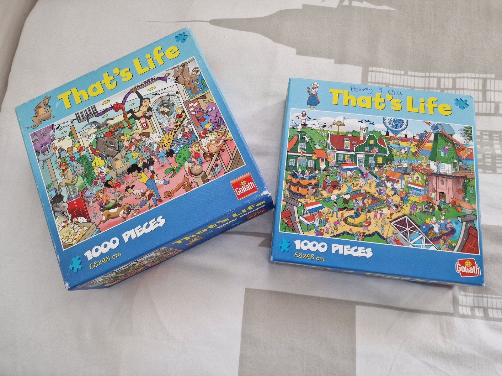 Twee Goliath 'That's Life' legpuzzels - 1000 stukjes, Ophalen of Verzenden, 500 t/m 1500 stukjes, Gebruikt, Legpuzzel