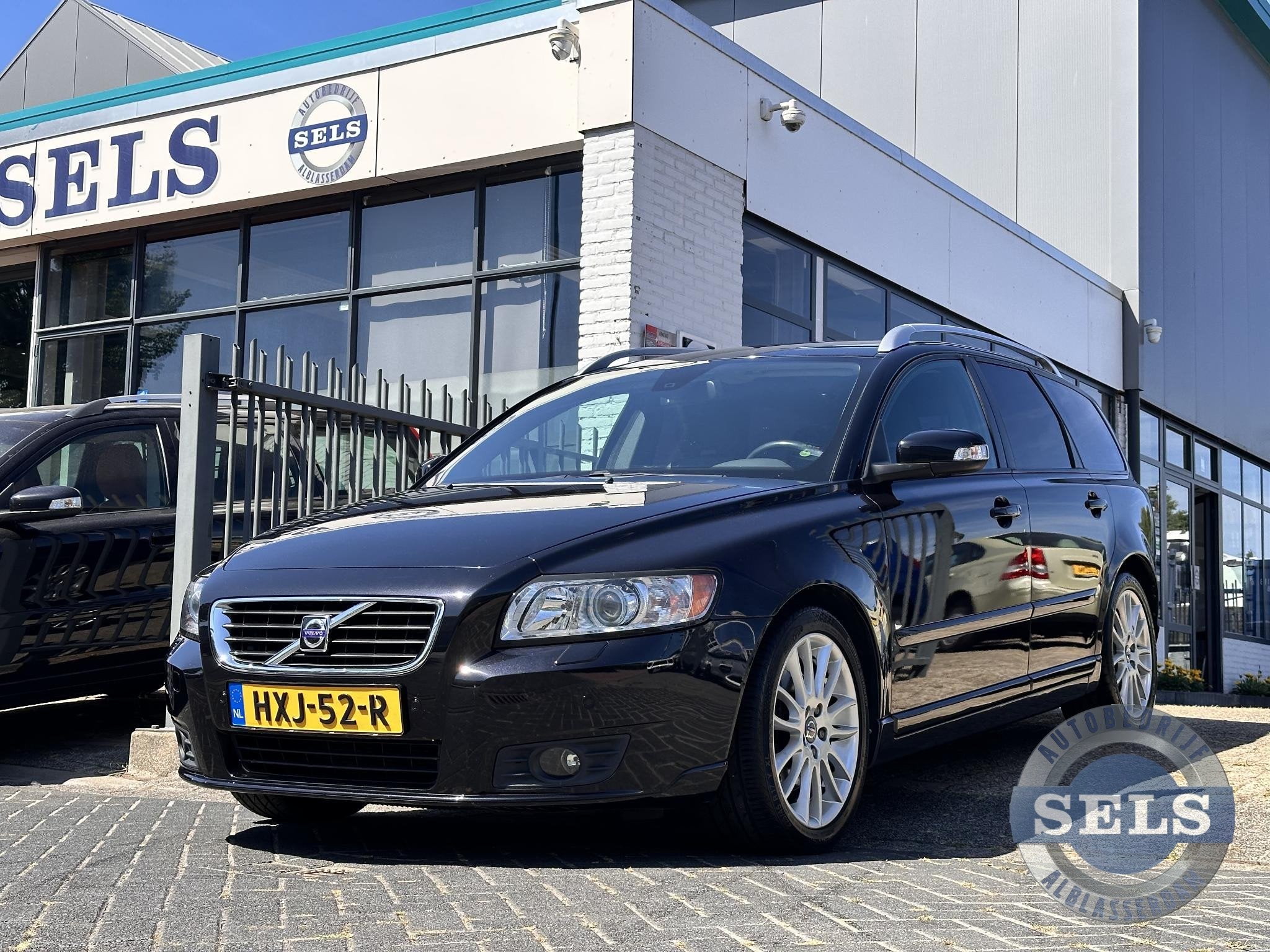Volvo V50 2.4i Summum 170PK/GEARTRONIC/XENON/LEDER, Auto's, Gebruikt, Zwart, 700 kg, Zwart