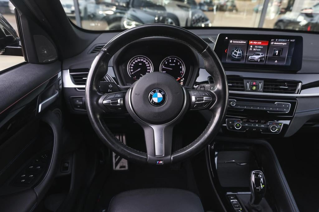 BMW X1 xDrive20i High Executive M Sport Automaat / Trekhaak, 1998 cc, Gebruikt, 4 cilinders, Zwart