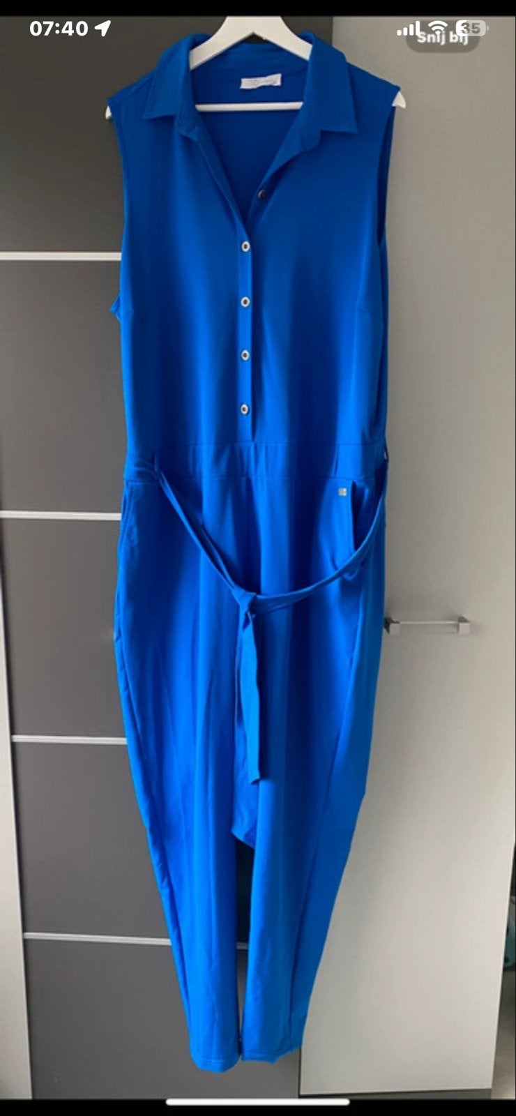 Blauwe jumpsuit met ceintuur travelstof., Ophalen of Verzenden, Zo goed als nieuw, Maat 38/40 (M), Blauw