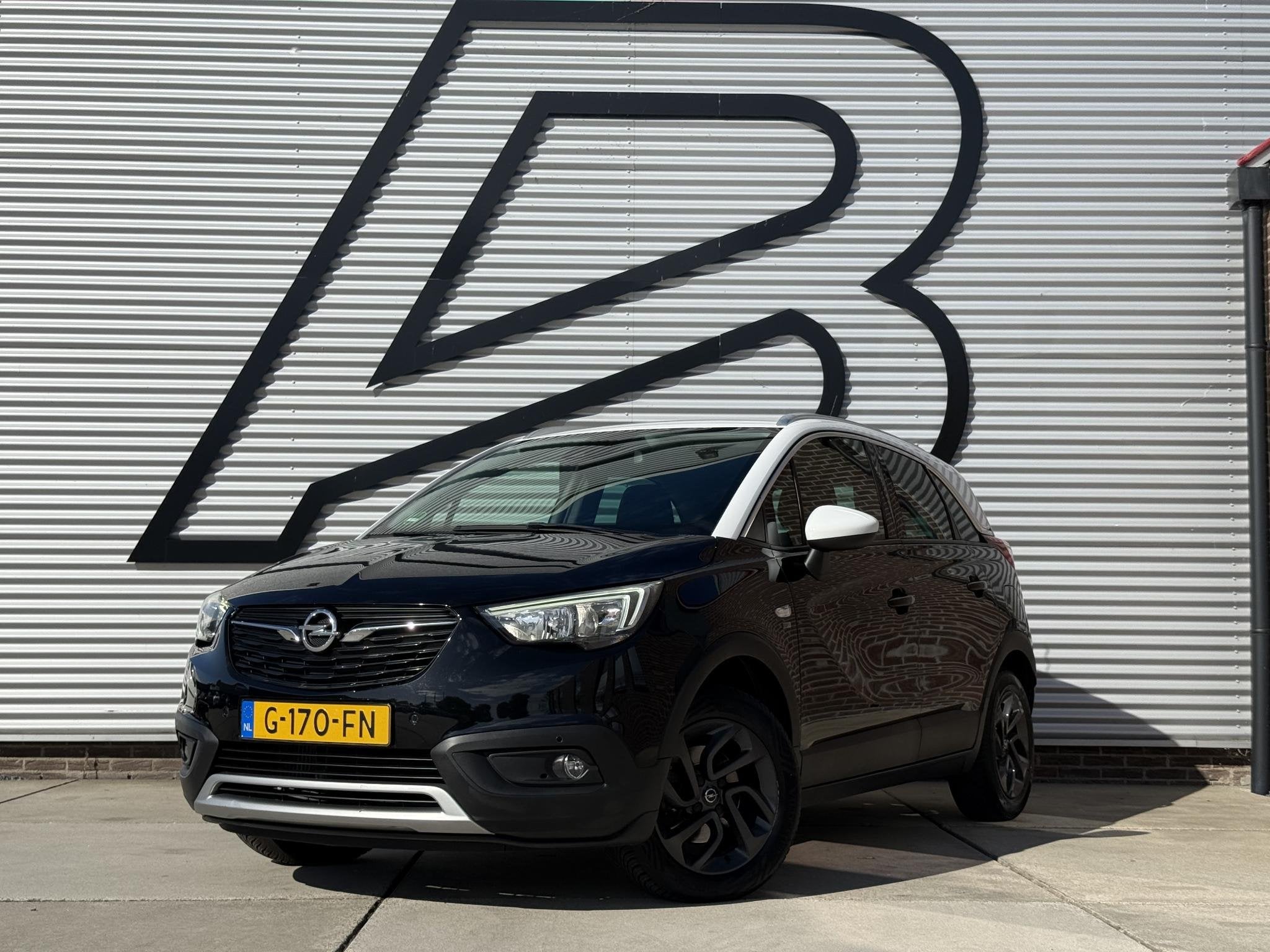 Opel Crossland X 1.2 Turbo 120 Jaar Edition 2e Eigenaar|Navi, Auto's, Gebruikt, Automatische klimaatregeling, Zwart, Origineel Nederlands