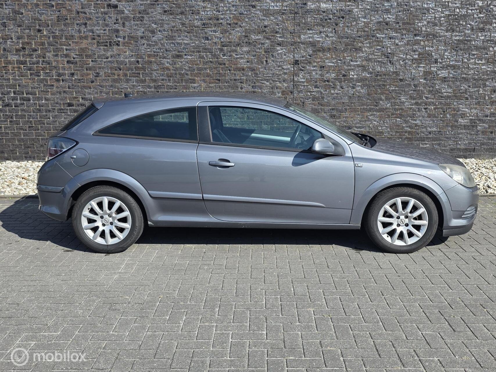Opel Astra GTC 1.4 Cosmo - Airco - Cruise - Automaat!, Auto's, Sportstoelen, Gebruikt, 4 cilinders, 49 €/maand