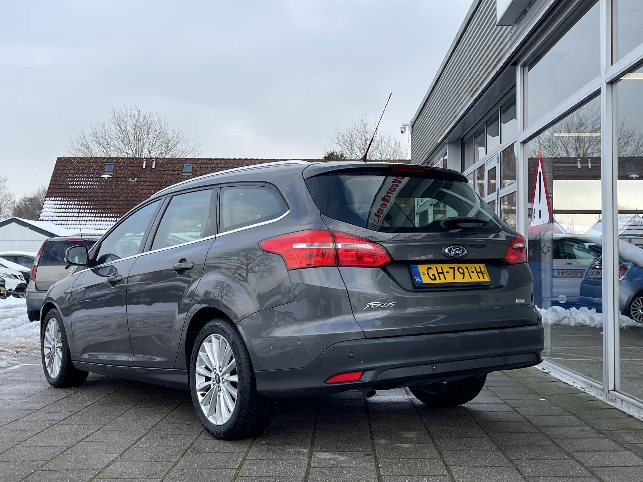 Ford Focus Wagon 1.0 First Edition /Cruise/Clima/Navi/2015/A, Gebruikt, Euro 6, Met garantie (alle), Parkeerassistent