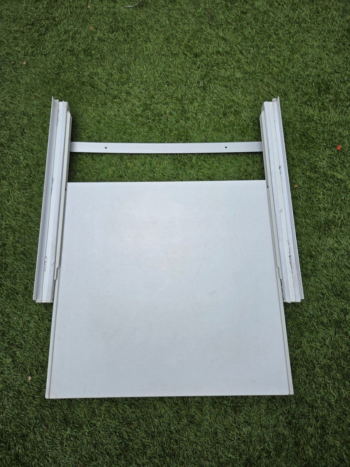 Tussen stuk wasmachine/droger, Ophalen