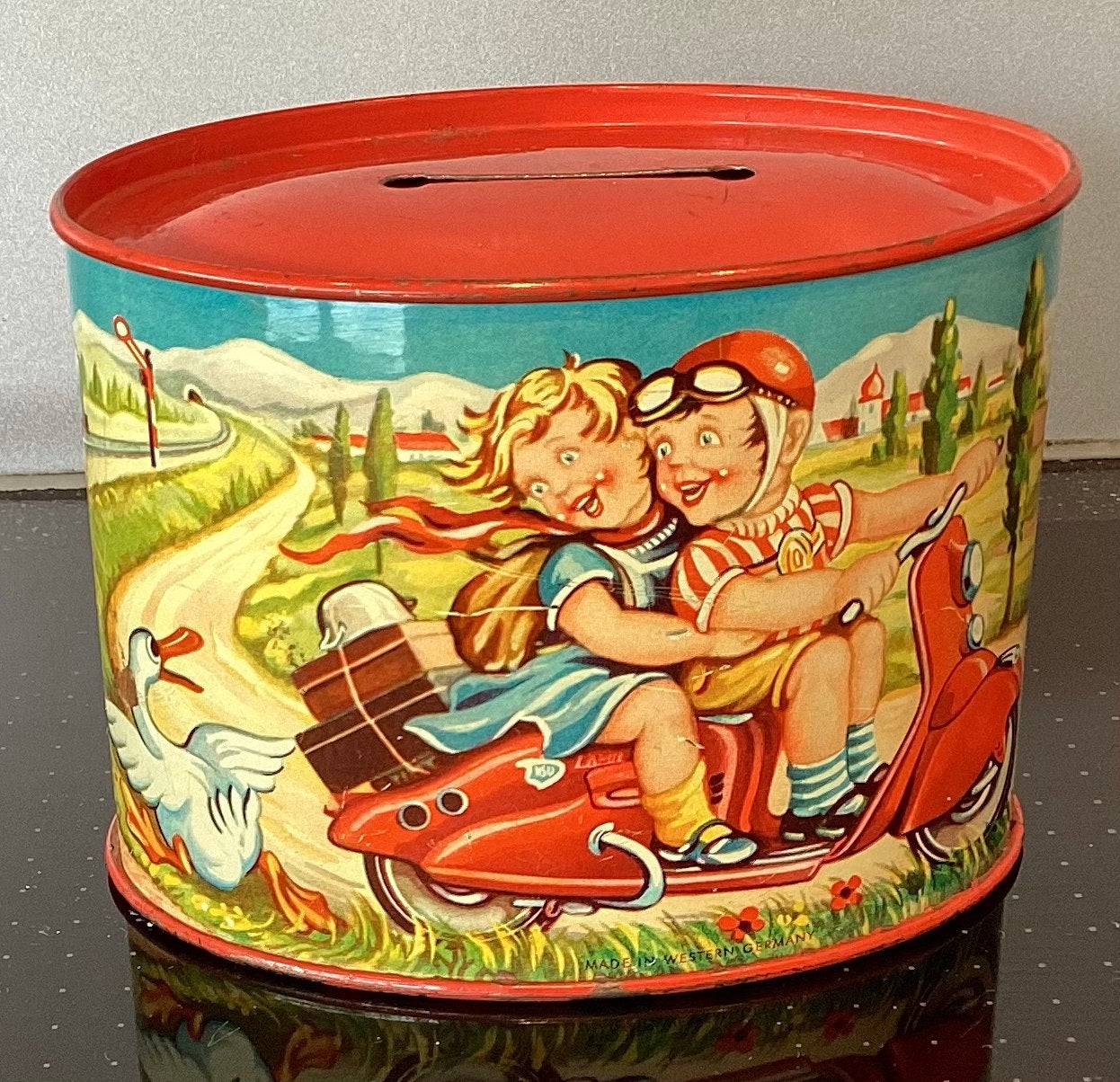 Oude 1950’s blikken spaarpot,scooter & trein litho,W.Germany, Antiek en Kunst, Antiek | Speelgoed, Ophalen