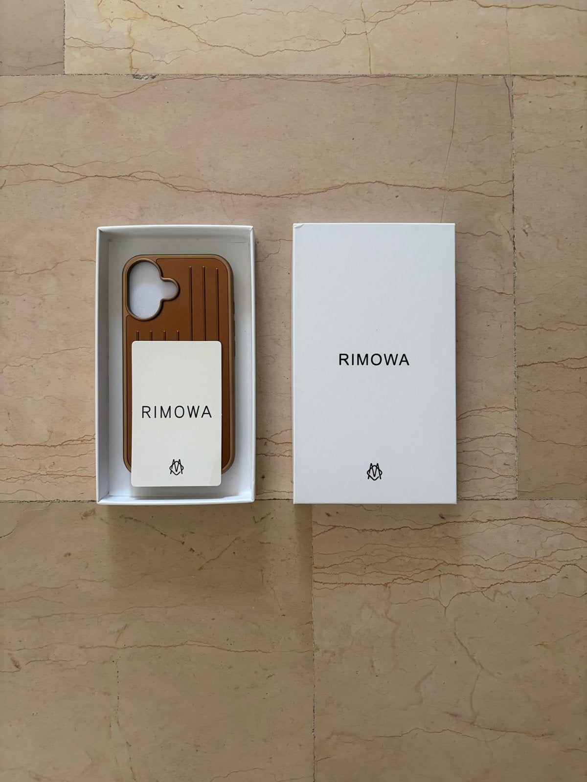 Rimowa iPhone Hoesje - Bruin, Ophalen of Verzenden, Zo goed als nieuw, Hoesje of Tasje