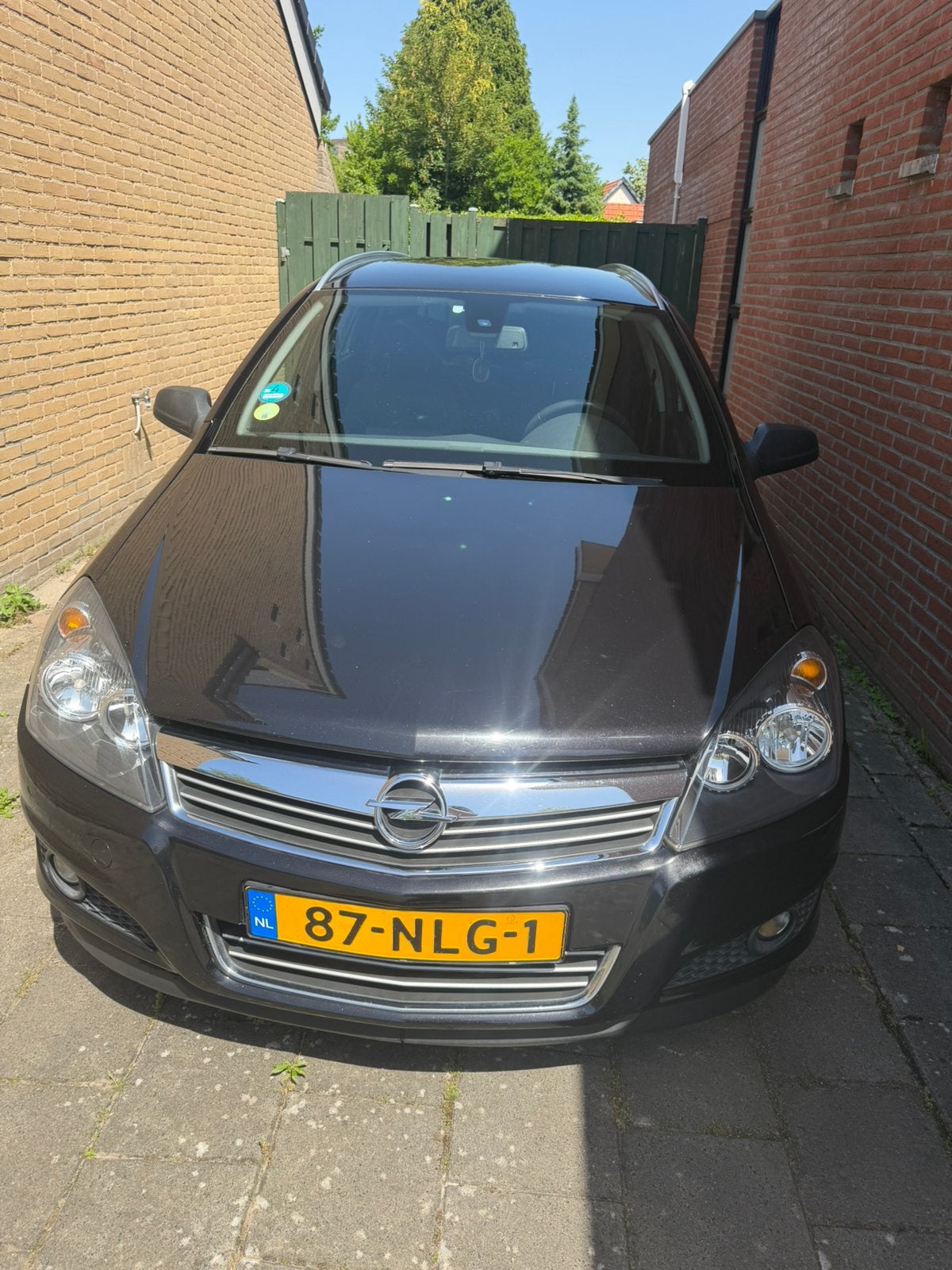 Opel Astra 111 edition 1.6 16V 85KW St.wgn. 2010 Zwart, Auto's, 1178 kg, Zwart, Stationwagon, 115 pk