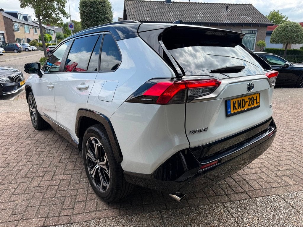 Toyota RAV4 2.5 Plug-in Hybrid AWD Bi-Tone Plus|Pano|Stoel V, Auto's, Toyota, Automaat, Gebruikt, 4 cilinders, Wit