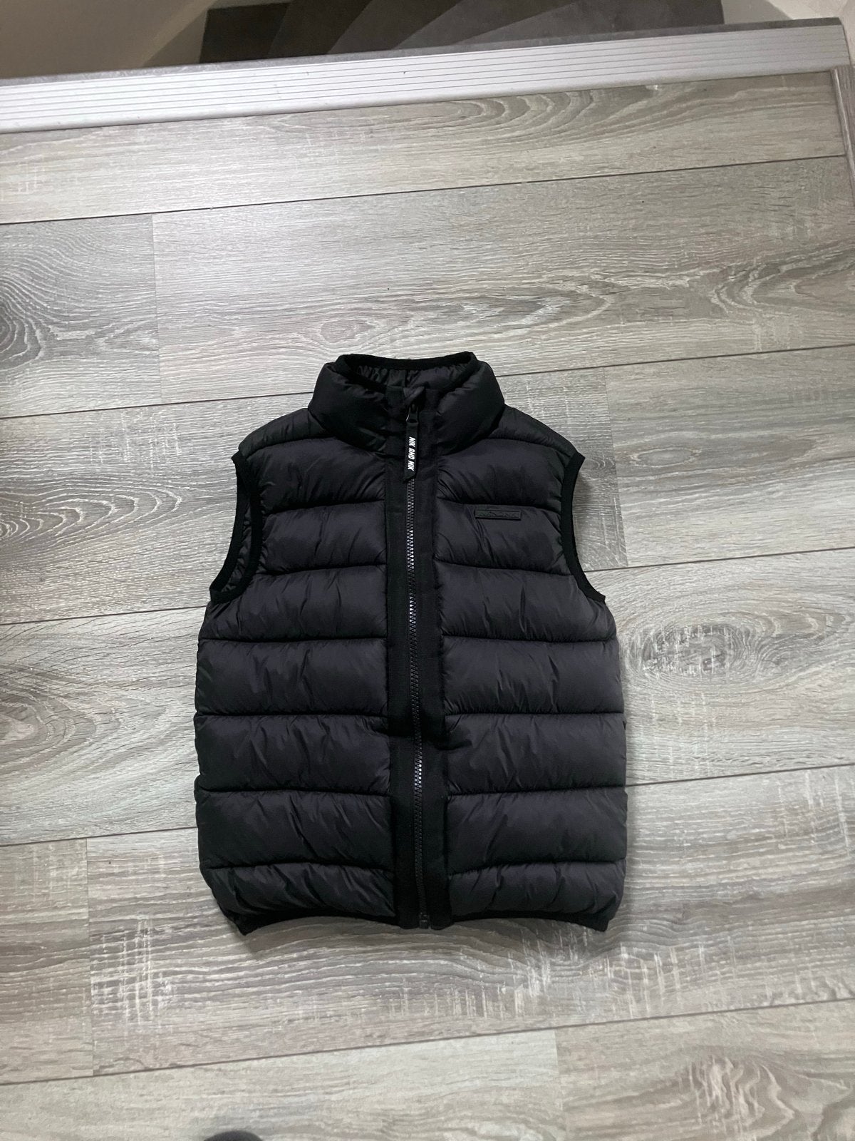 NIK&NIK Bodywarmer Zwart Maat 128, Ophalen of Verzenden, Zo goed als nieuw, Jongen, Jas