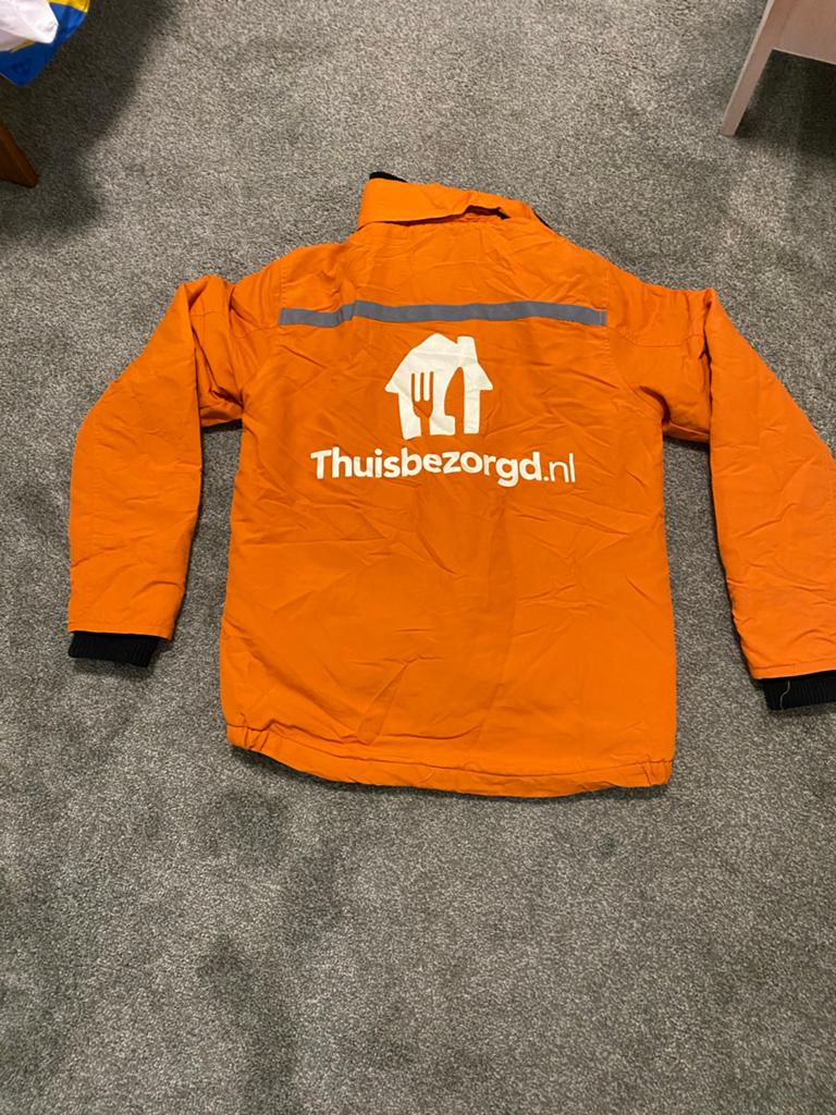 Thuisbezorgd jas maat S  nieuw, Ophalen of Verzenden, Nieuw, Maat 36 (S), Oranje