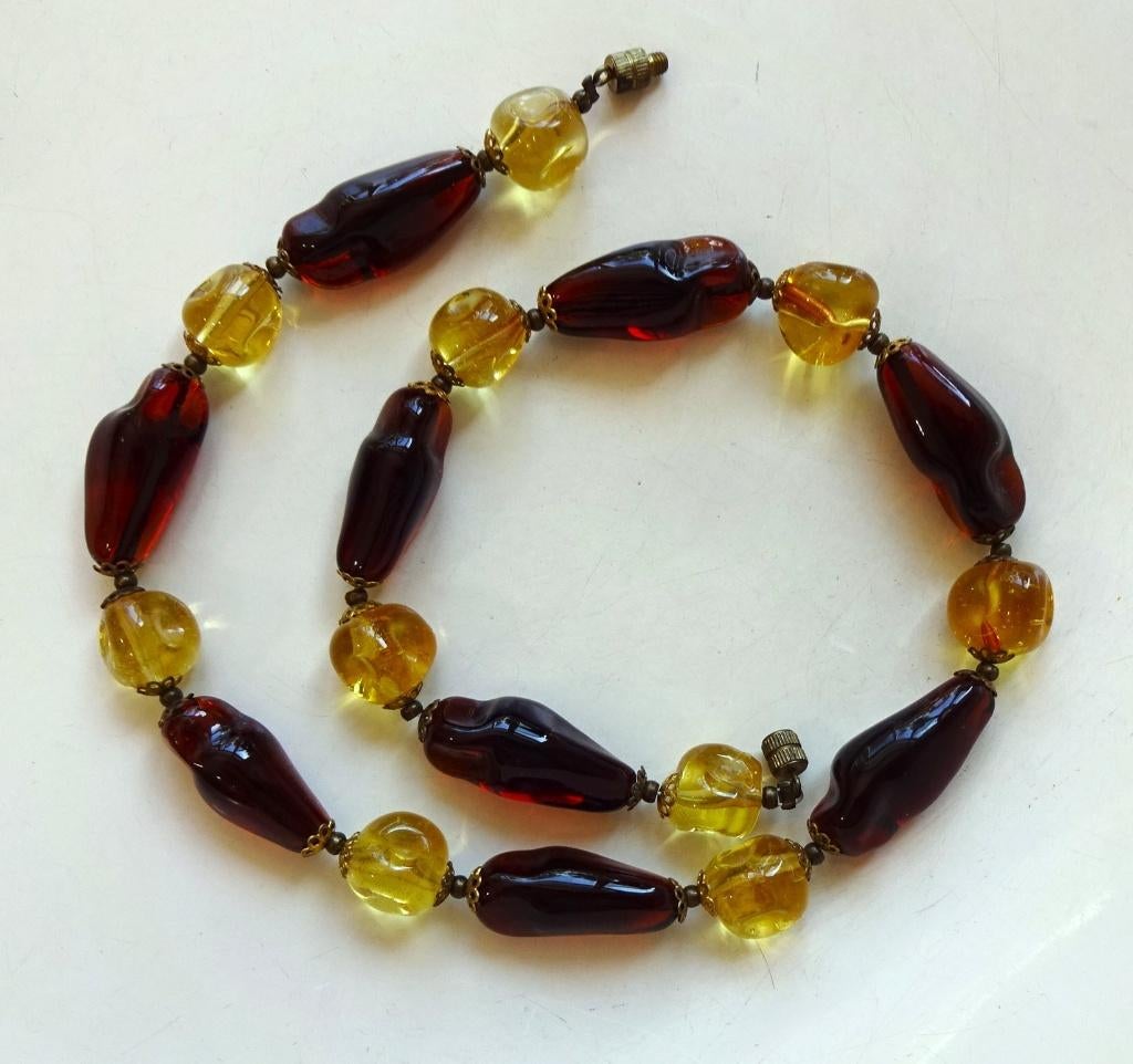 Vintage 'amber' glazen kralen ketting: geel + cognac, Ophalen of Verzenden, Overige materialen, Ketting