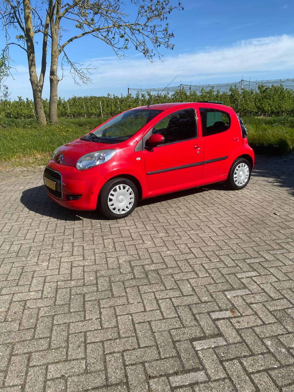 Citroën C1 1.0i 68PK 5D 2012 Rood, Auto's, Voorwielaandrijving, Stof, Zwart, 4 stoelen