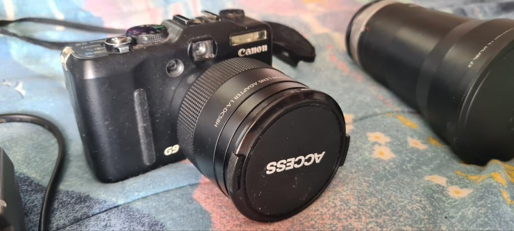 Canon G9 met 2 extra lenzen en accus, Audio, Tv en Foto, Fotocamera's Digitaal, Canon, 10 Megapixel, Ophalen of Verzenden, Zo goed als nieuw