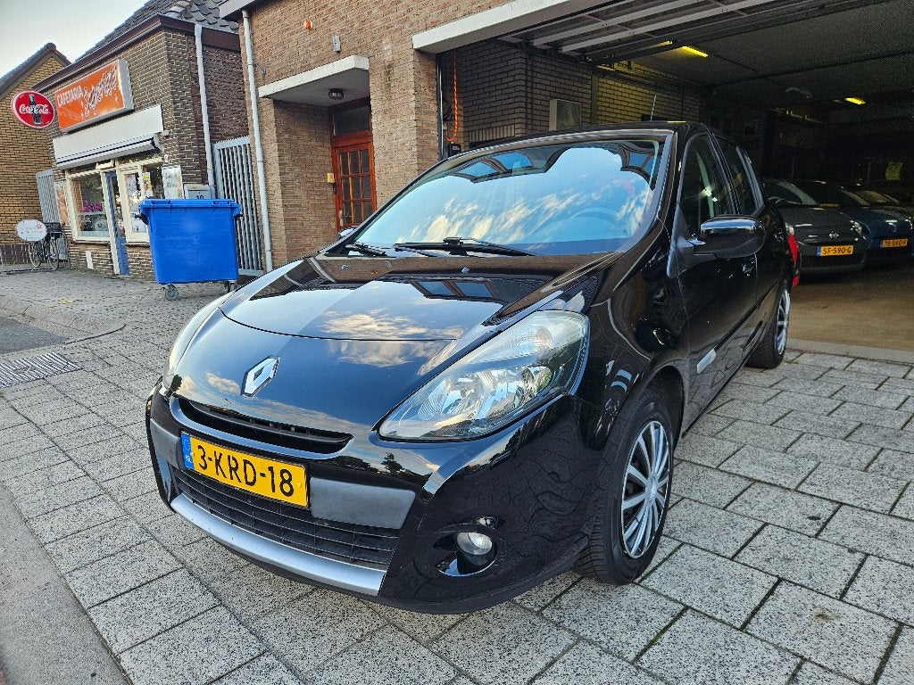 Renault Clio 1.2 16V Collection 55KW 5-DRS E4 2012 Zwart, Voorwielaandrijving, Euro 5, Stof, 74 pk