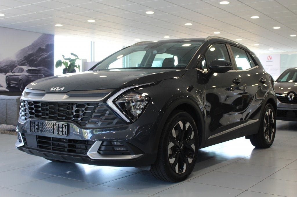 Kia Sportage 1.6 plug-in/CARPLAY/CAMERA/CRUISE (bj 2024), Auto's, Kia, Automaat, Stof, Gebruikt, Zwart