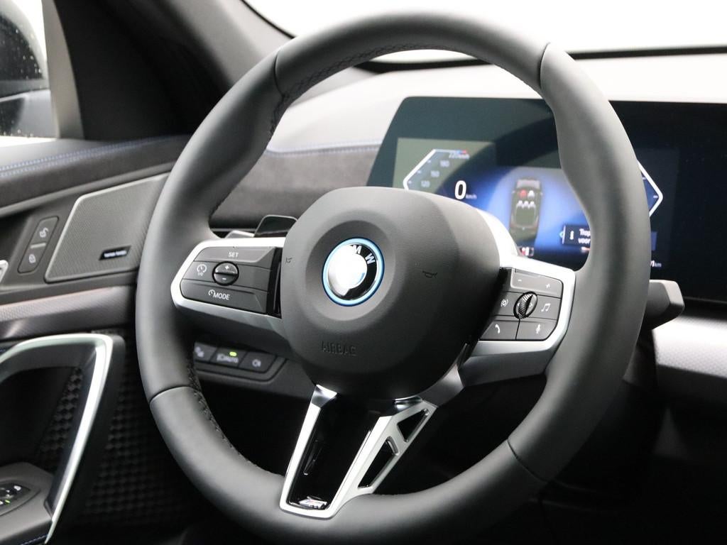 BMW iX2 eDrive20 67 kWh M Sport Edition (bj 2025, automaat), Auto's, BMW, 478 km, IX2, Met garantie (alle), 24 min
