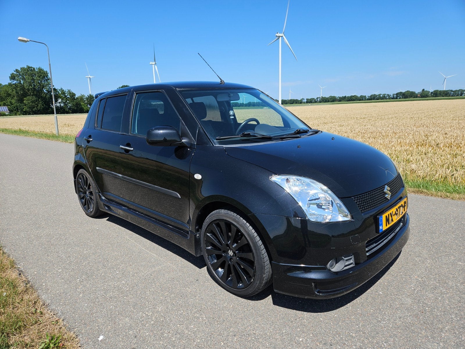 Suzuki Swift 1.3 5D 2007 Zwart, Auto's, Voorwielaandrijving, 40 €/maand, 965 kg, 400 kg