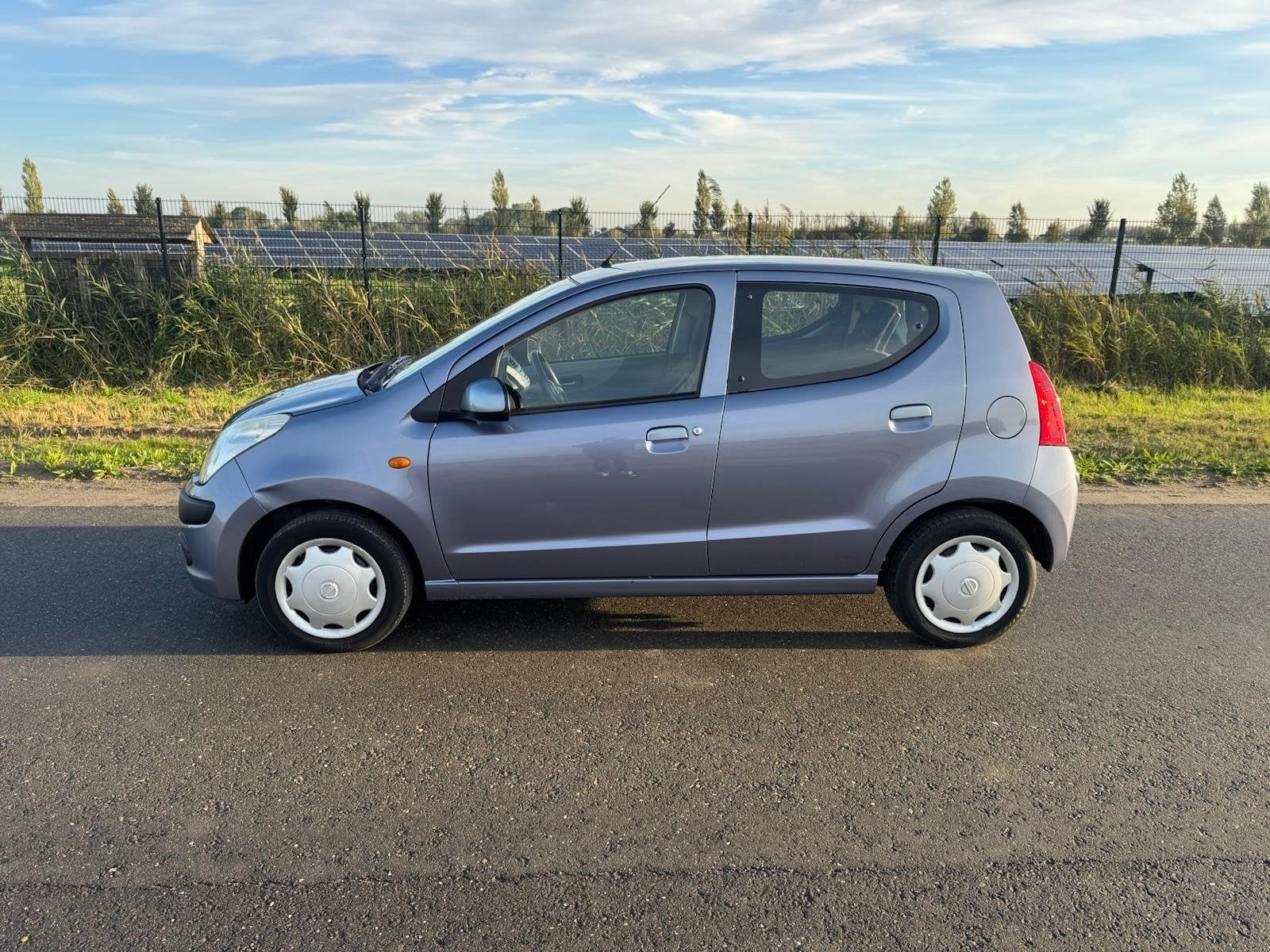 Nissan Pixo 1.0 50KW 5D 2009 Grijs, Auto's, Voorwielaandrijving, Stof, 200 kg, 4 stoelen