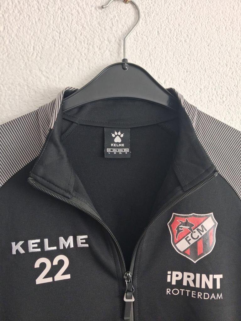 Kelme trainingsjack FC Maense maat L, Maat 52/54 (L), Kelme, Zwart, Ophalen of Verzenden