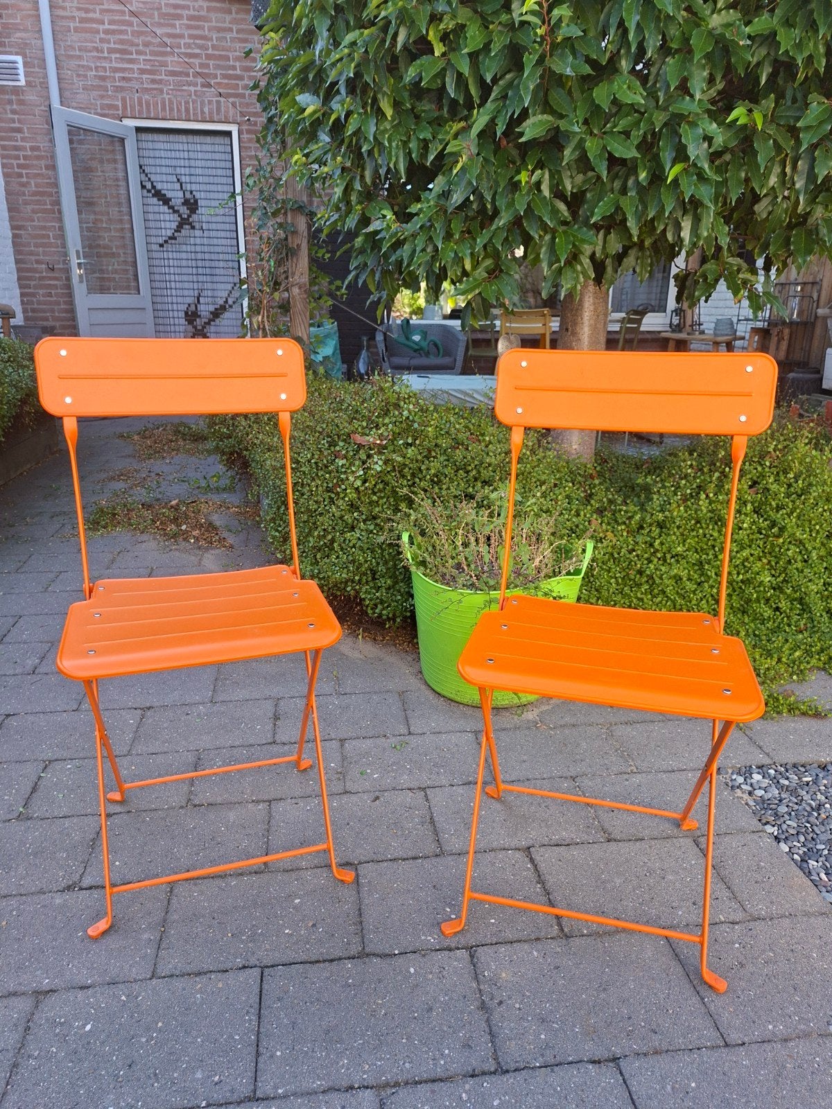 2x Oranje inklapbare tuinstoelen, Ophalen, Gebruikt, Metaal, Inklapbaar