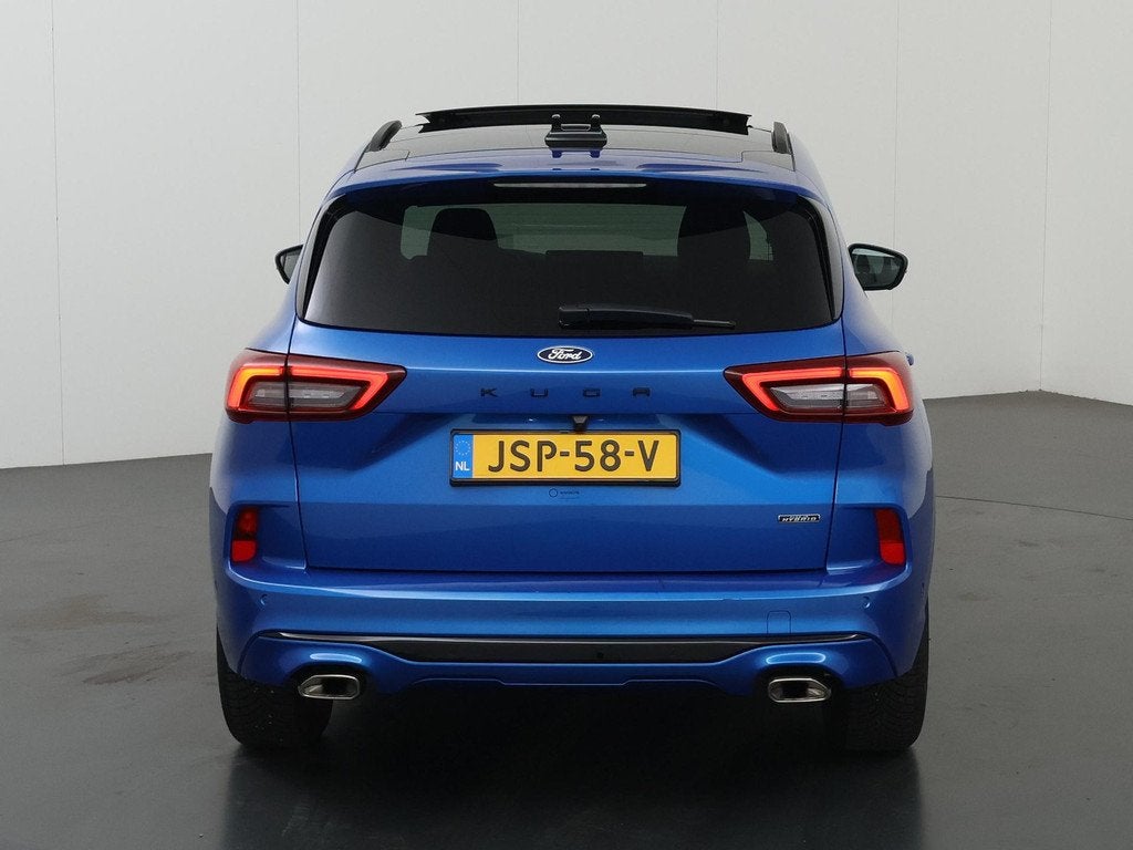 Ford Kuga 2.5 PHEV ST-Line X | Elekt inklapbare Trekhaak | P, Auto's, Ford, 14 kWh, Gebruikt, Blauw, Leder en Stof