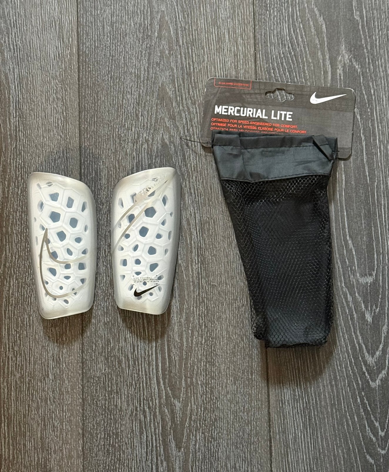 Nike Mercurial Lite scheenbeschermers - Nieuw met tasje, Ophalen of Verzenden, Nieuw, Overige typen