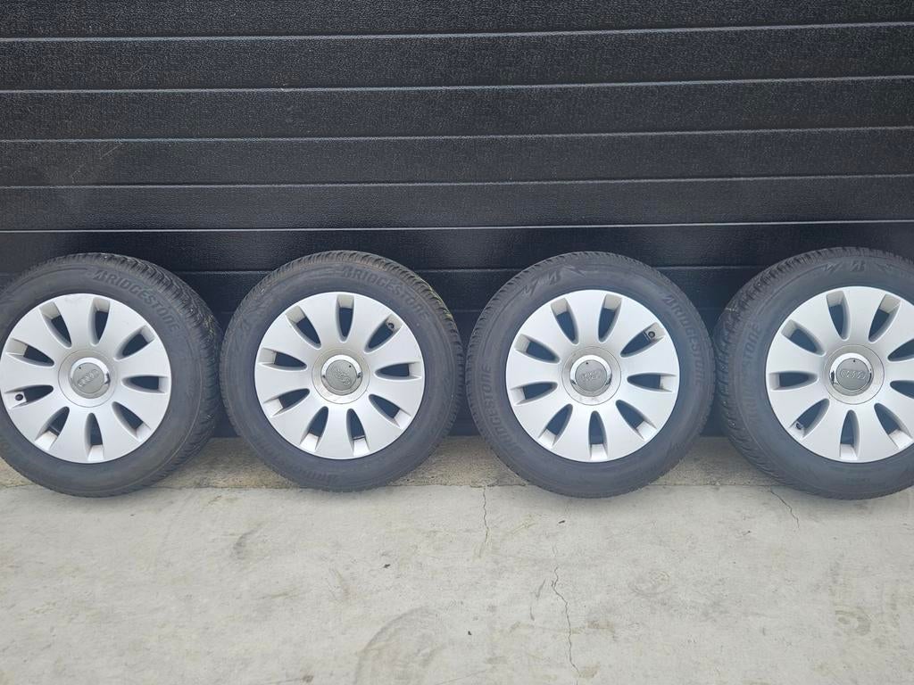 Audi winterbanden met wieldoppen, Ophalen of Verzenden