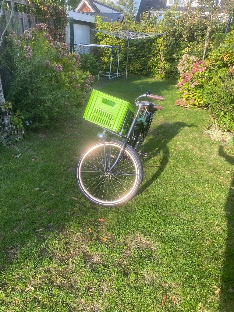 Cortina fiets met groen mandje