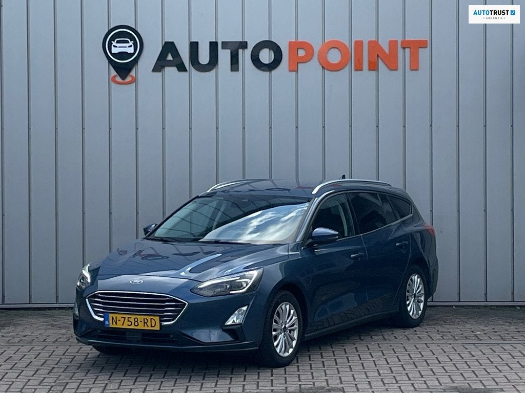 Ford Focus Wagon 1.0 Titanium X Business AUTOMAAT 1E EIG DEA, Auto's, Ford, 1328 kg, Gebruikt, Euro 6, Blauw