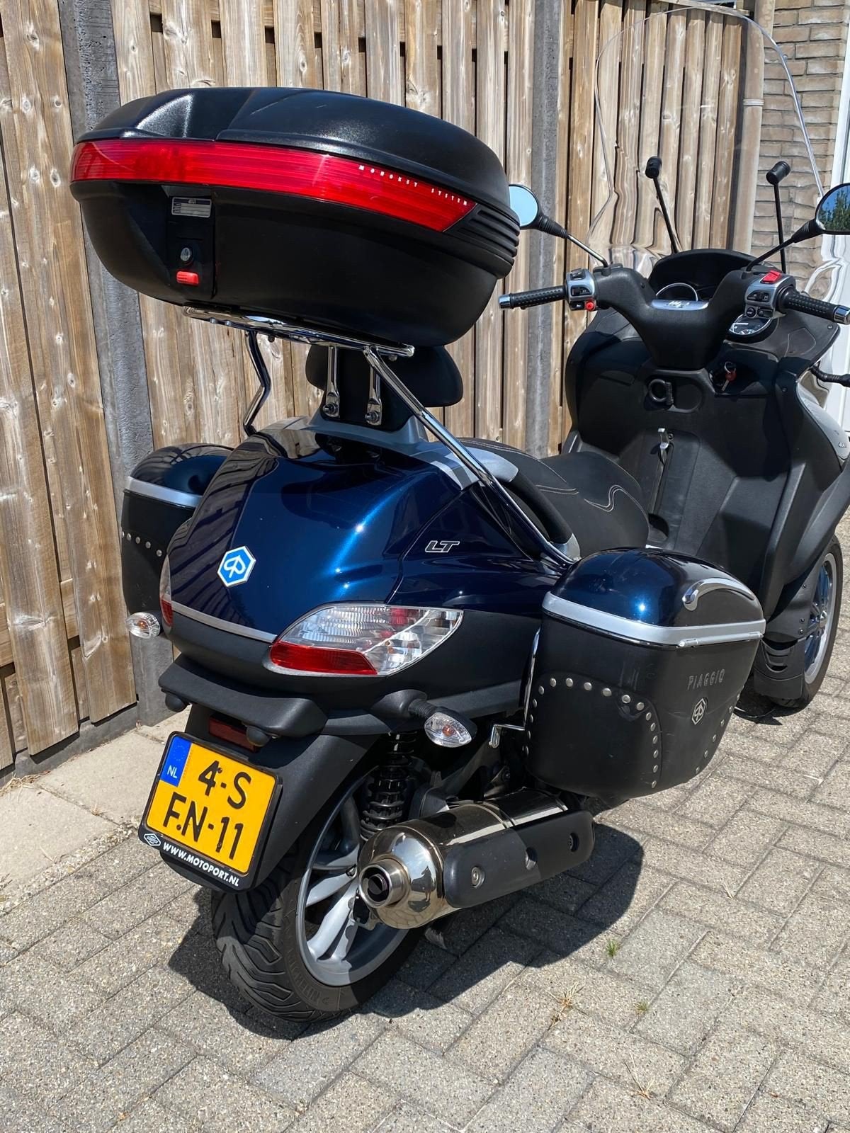 Exclusieve kofferset Piaggio MP3 2011, Ophalen