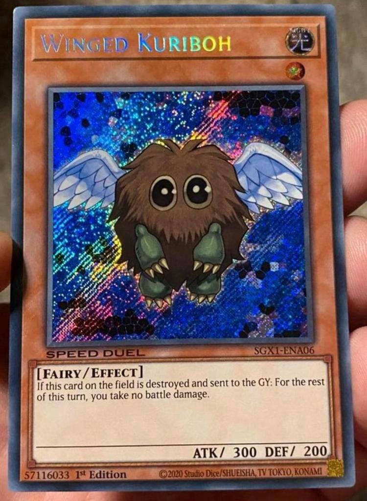 Yu-Gi-Oh! Winged Kuriboh SGX1 1st Edition !, Ophalen of Verzenden, Zo goed als nieuw, Losse kaart, Foil