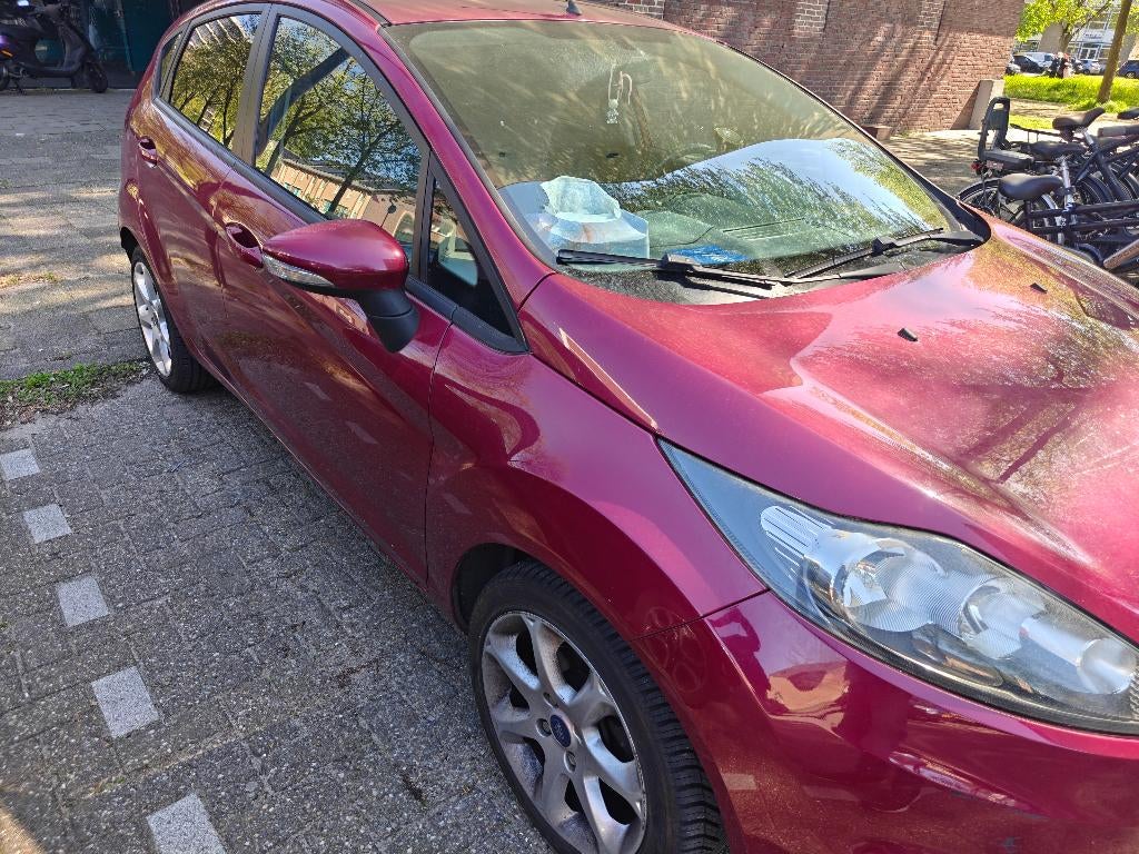 Ford Fiësta 1.25 60KW 5DR 2010 Rood, Voorwielaandrijving, Euro 5, Leder en Stof, Handgeschakeld