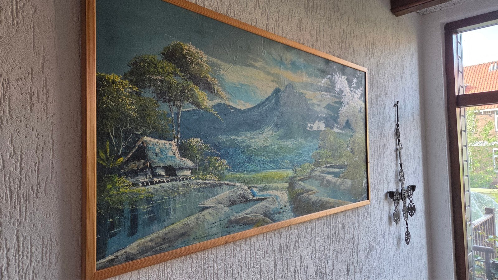 Schilderij met berglandschap en waterval, Ophalen