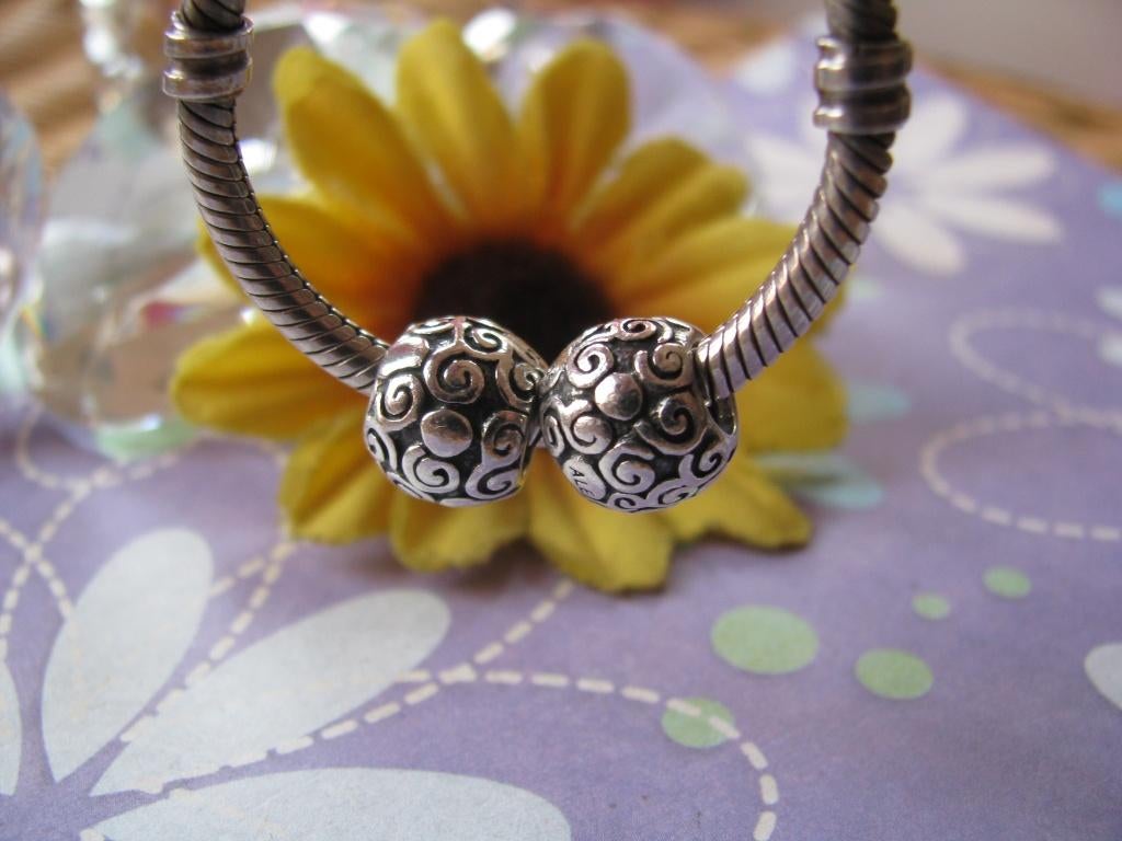 2 x Pandora bedel P144 = krullen/stippen in 1 koop = € 17.50, Pandora, Ophalen of Verzenden, Zo goed als nieuw, 2 of 3 bedels