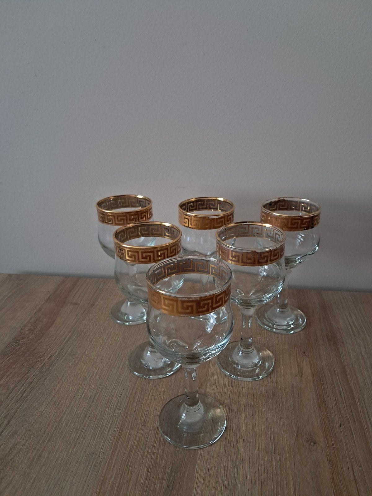 Set van 6 wijnglazen met gouden Griekse rand, Ophalen