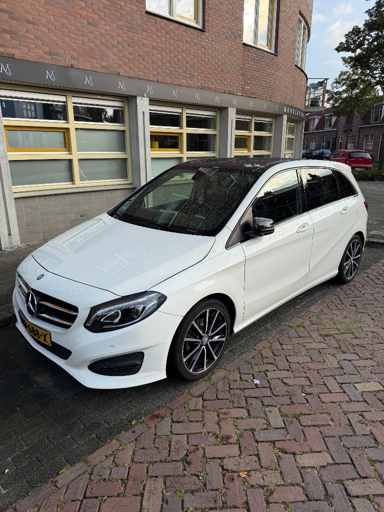 Mercedes-Benz B-Klasse 1.6 B180 5DRS BE Dct7 2015 Wit, 1325 kg, Zwart, 4 cilinders, Leder en Stof