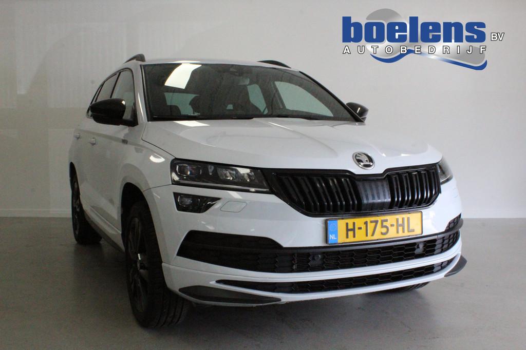 Skoda Karoq 1.5 TSI ACT Sportline Business | CANTON | TREKHA, Stof, 4 cilinders, 150 pk, Wit