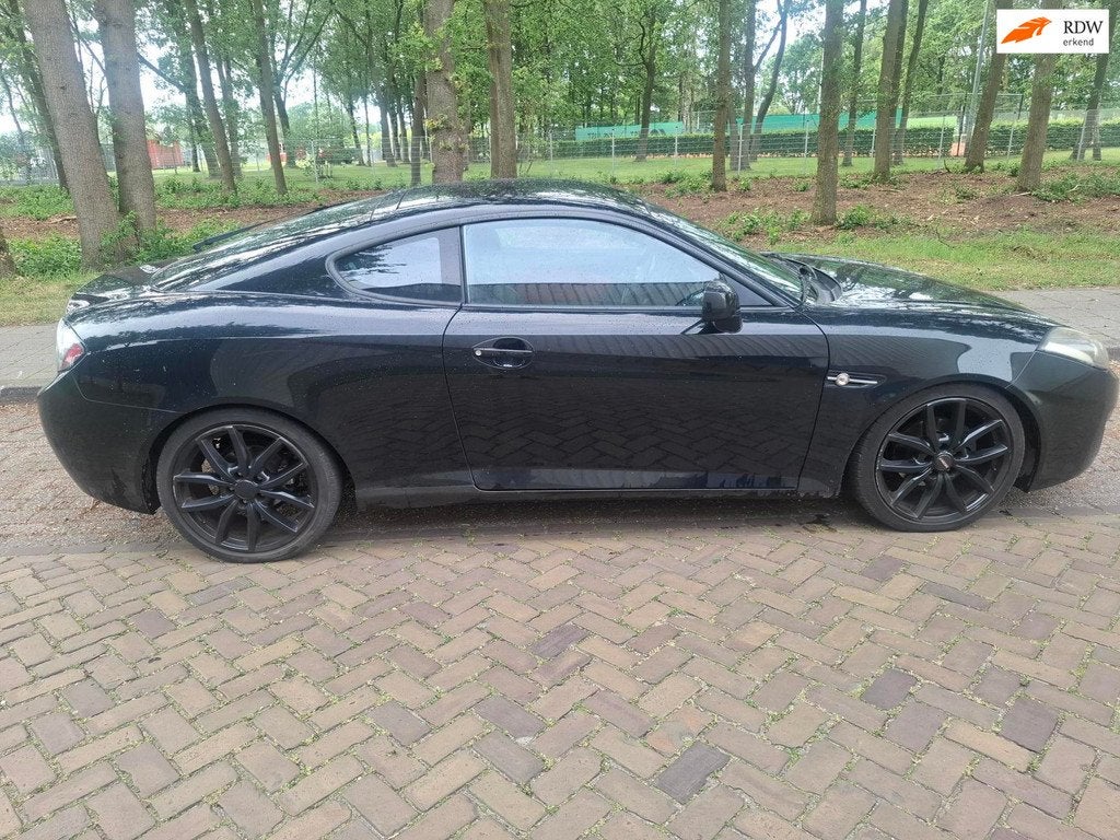 Hyundai Coupé 2.7i V6 Style apk 17-06-2027, Auto's, Hyundai, Gebruikt, Coupé, 2656 cc, Zwart