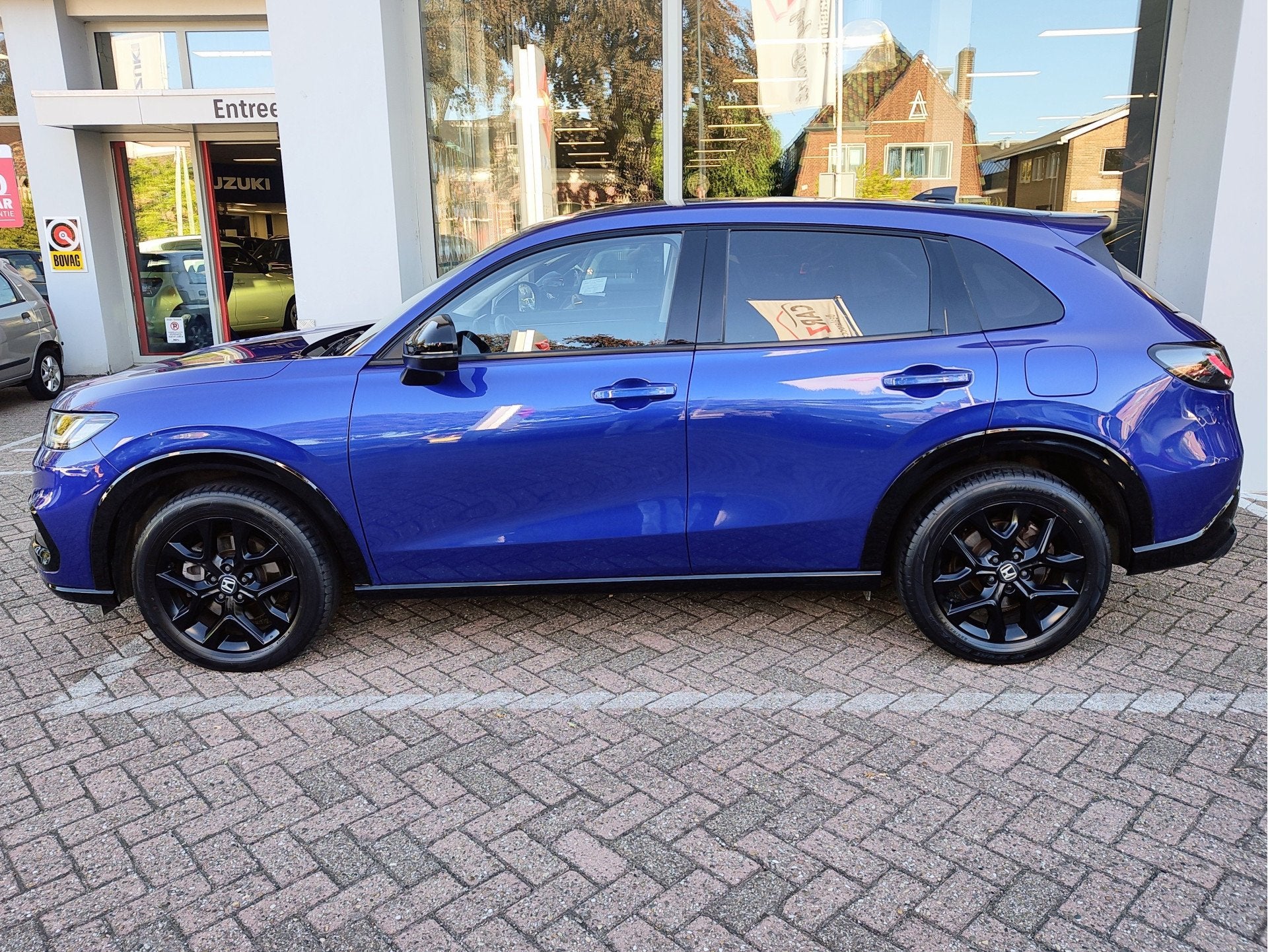Honda Zr-V 2.0 e:HEV SPORT AUTOMAAT Keyless | Elek. verst. s, Auto's, Gebruikt, 4 cilinders, Blauw, Bedrijf
