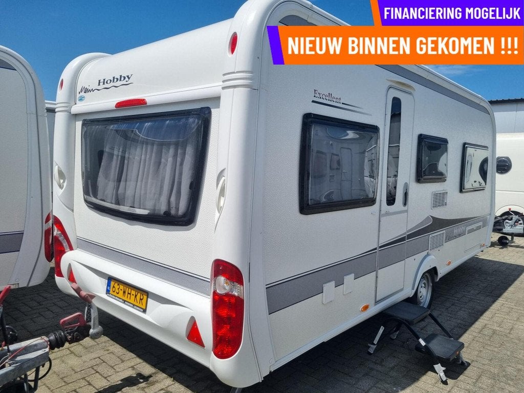 Hobby 495 UL excellent ENKELE BEDDEN + VOORTENT + FIETSENDR, Caravans en Kamperen, Caravans, Hordeur, Rondzit, Hobby, 7 tot 8 meter