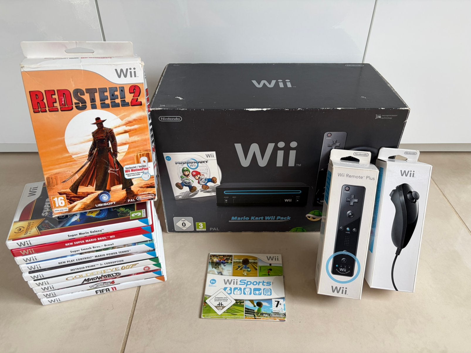 Nintendo Wii Mario Kart Pack met 12 games & extra controller, Ophalen of Verzenden, Gebruikt, Met 2 controllers, Met games