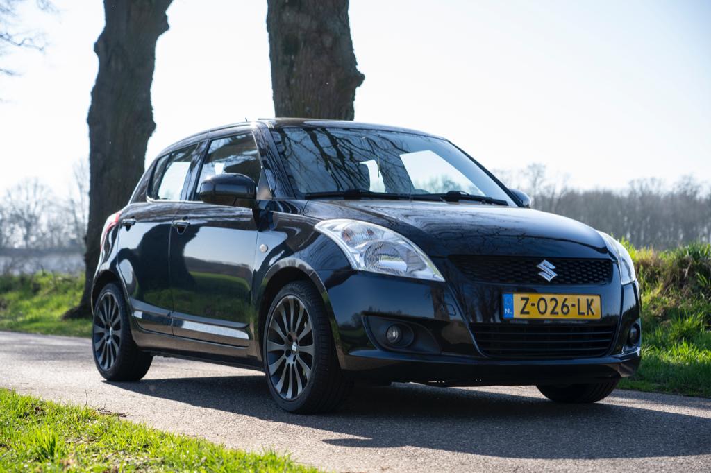 Suzuki Swift 1.2 Extra Edition 5-Deurs 2010 Zwart, Voorwielaandrijving, Stof, 4 cilinders, 400 kg