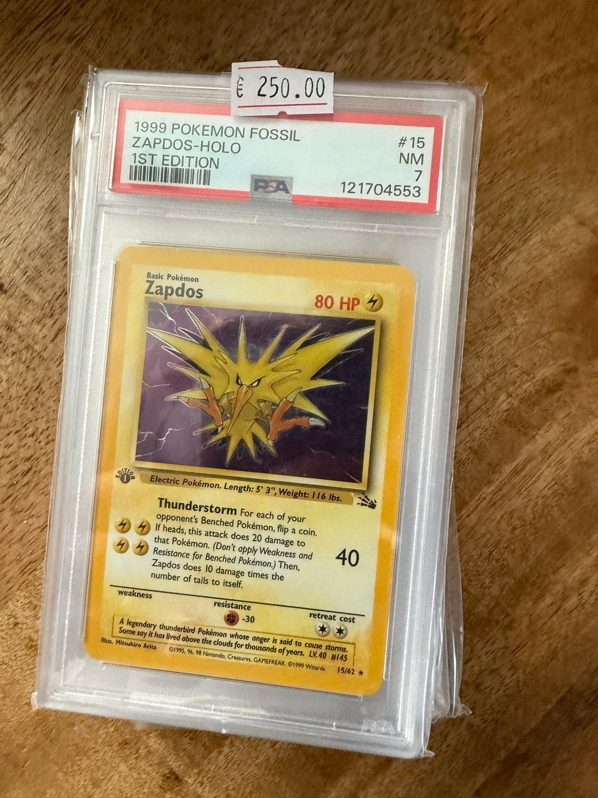 1999 Pokémon Fossil Zapdos Holo 1st Edition PSA 7, Ophalen of Verzenden, Zo goed als nieuw, Losse kaart