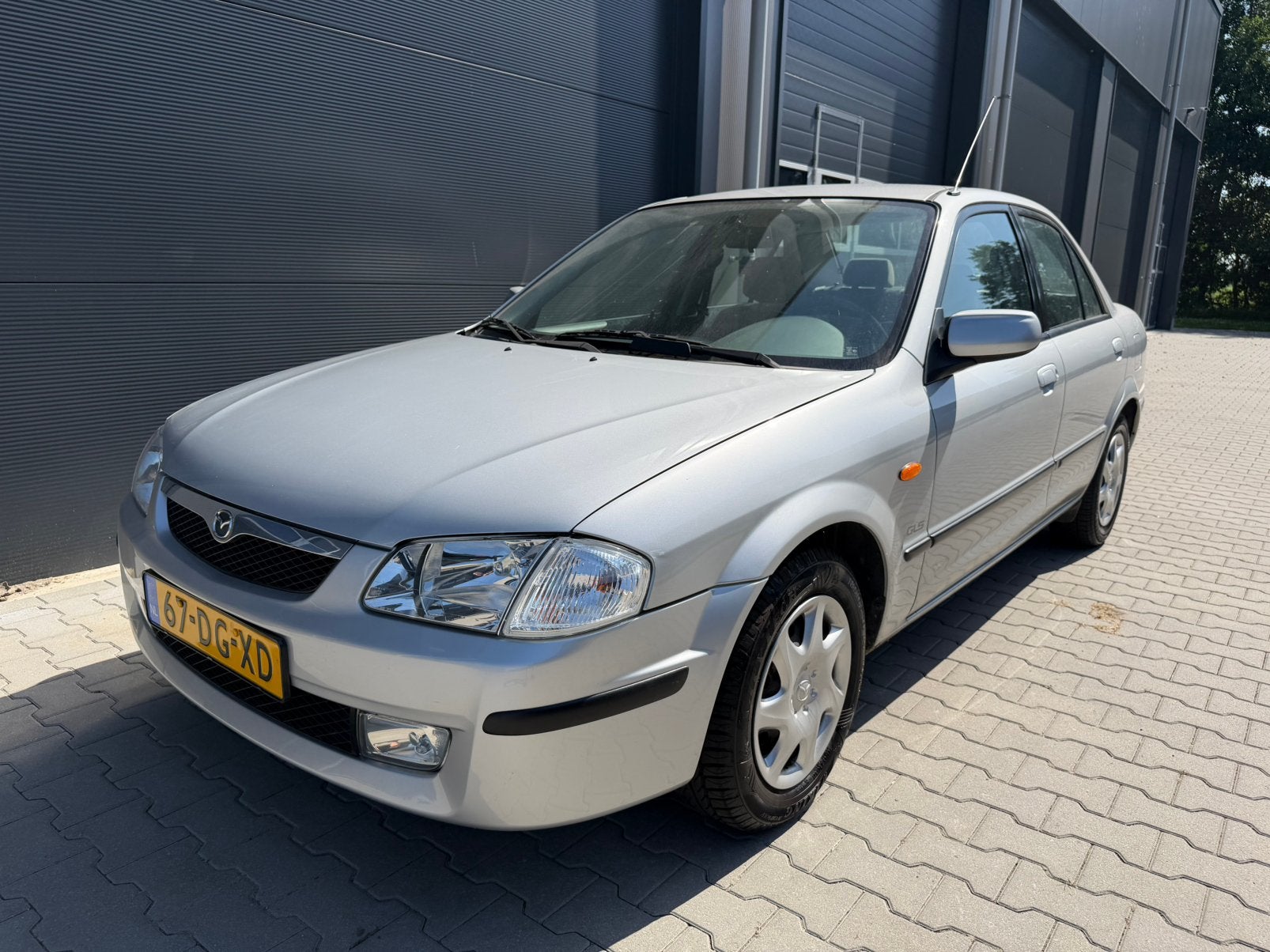 Maxda 323 GLS 1.6i 16V bj 1999 1e eigenaar 64dkm UNIEK‼️, Auto's, Voorwielaandrijving, Bedrijf, Handgeschakeld, Grijs