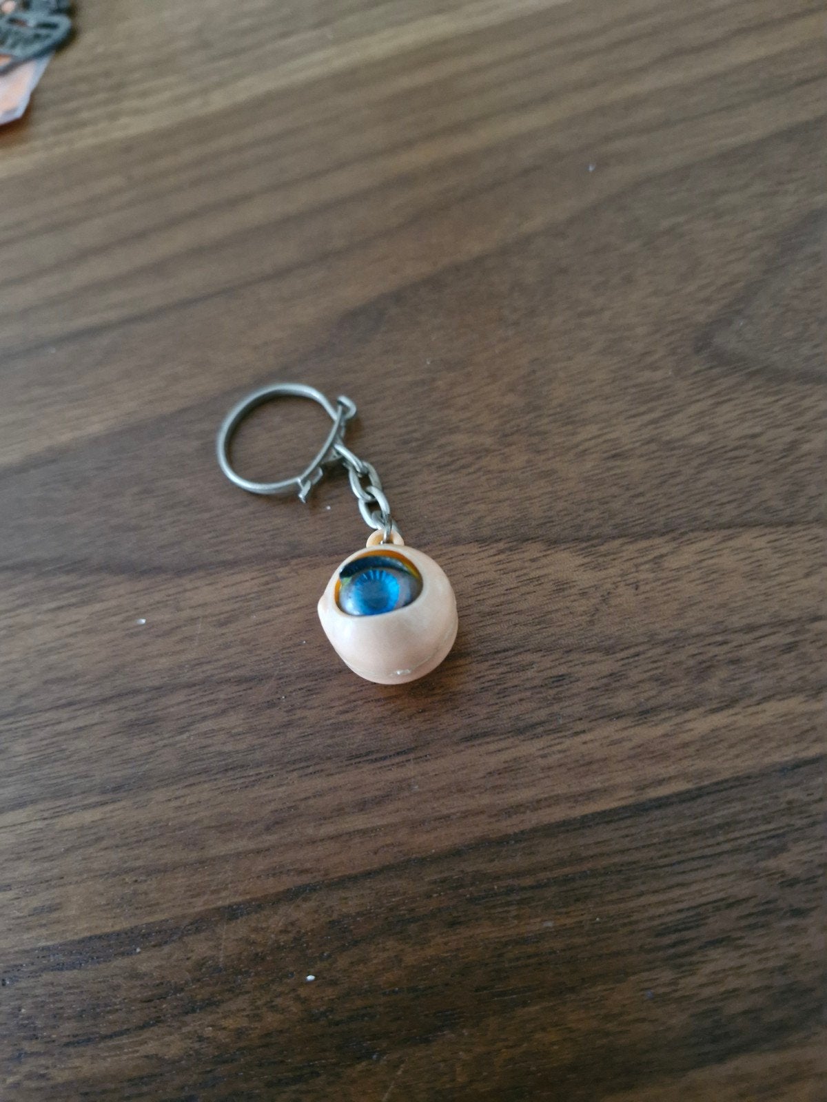 049 Sleutelhanger met oog, Ophalen of Verzenden, Gebruikt, Overige typen