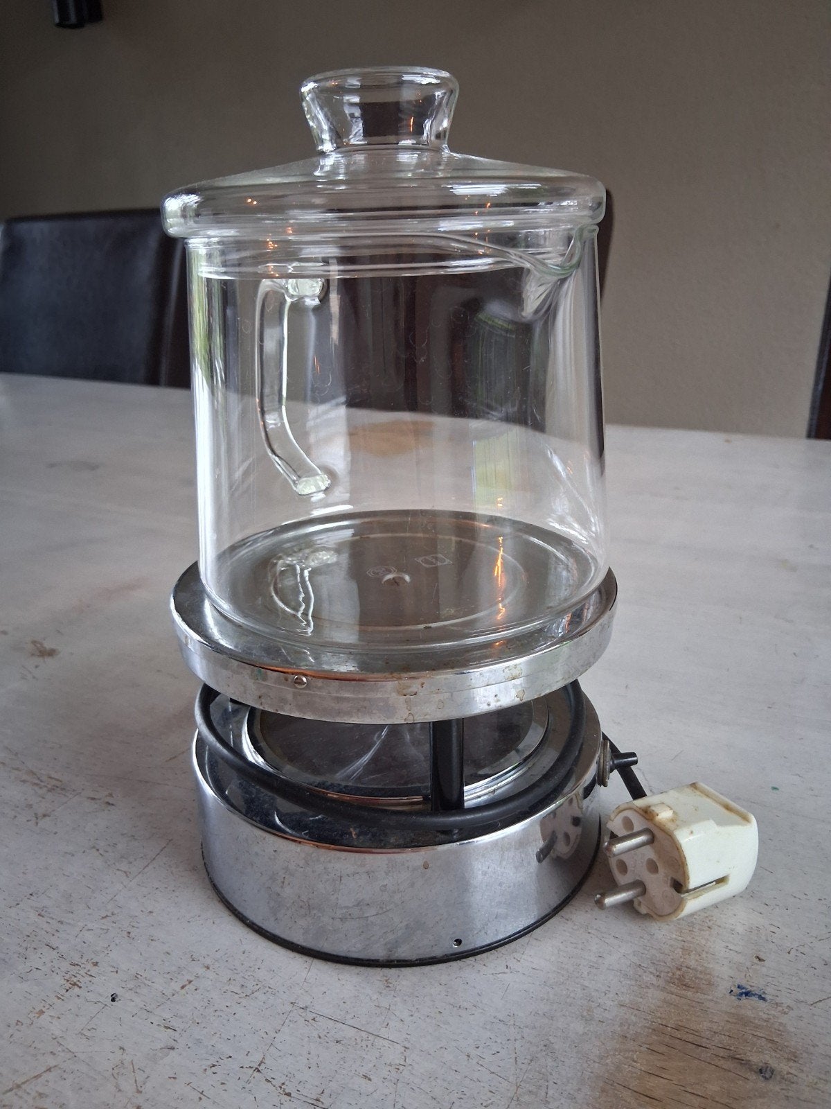 theelicht met theepot, Ophalen